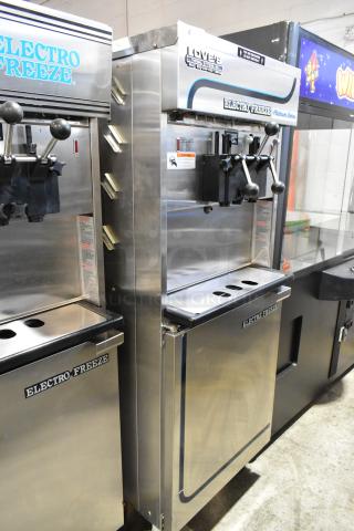 Electro Freeze 4000EP-132 stainless steel soft serve machine with two flavors and twist, on casters, water-cooled.