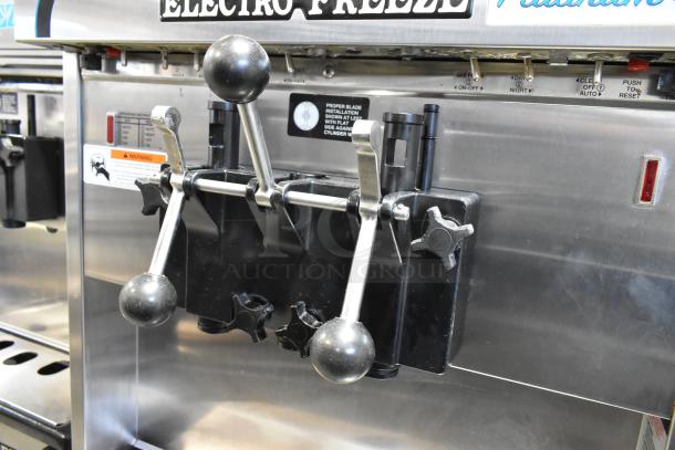 Electro Freeze 4000EP-132 stainless steel soft serve machine, two flavors with twist, water cooled, on commercial casters.