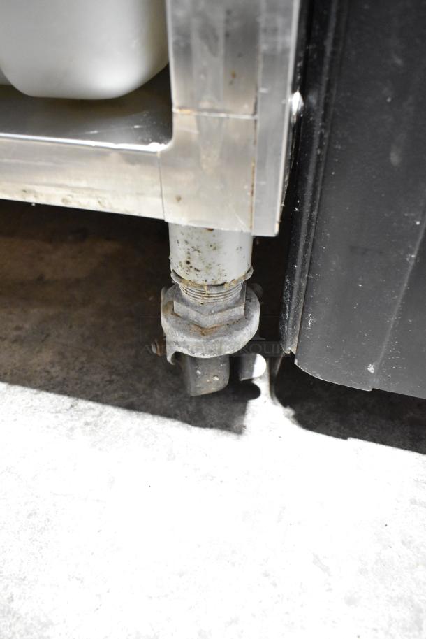 Electro Freeze 4000EP-132 ice cream machine caster. Stainless steel, commercial grade, minor wear visible.