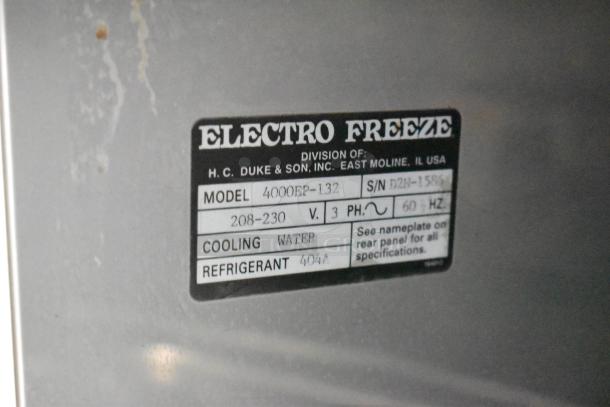 Electro Freeze 4000EP-132 soft serve machine label showing model, cooling type, voltage, phase, and refrigerant info.