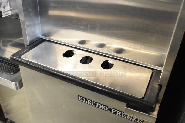 Electro Freeze 99T-RMT-137 stainless steel soft serve machine, water-cooled, on casters, visible brand logo, excellent condition.