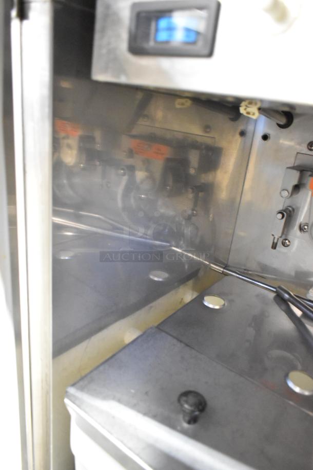 Electro Freeze 99T-RMT-137 soft serve machine, stainless steel, water-cooled, 2 flavors, twist option, commercial casters.