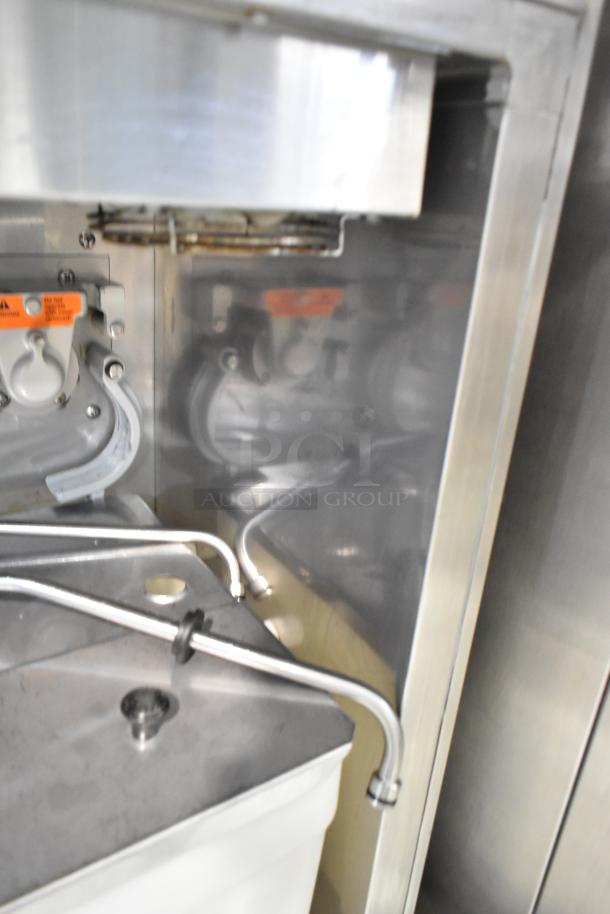 Electro Freeze 99T-RMT-137 stainless steel soft serve ice cream machine, commercial grade, water-cooled, 2-flavor with twist, on casters.