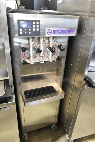 Stoelting F231-18I2YGAD1 stainless steel soft serve ice cream machine, 2 flavors with twist, commercial casters, 208-240V, 1 phase.