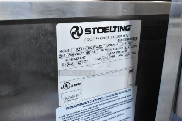 Stoelting F231-18I2YGAD1 soft serve machine, stainless steel, 2-flavor w/ twist, commercial casters, 208-240V, 1 phase.