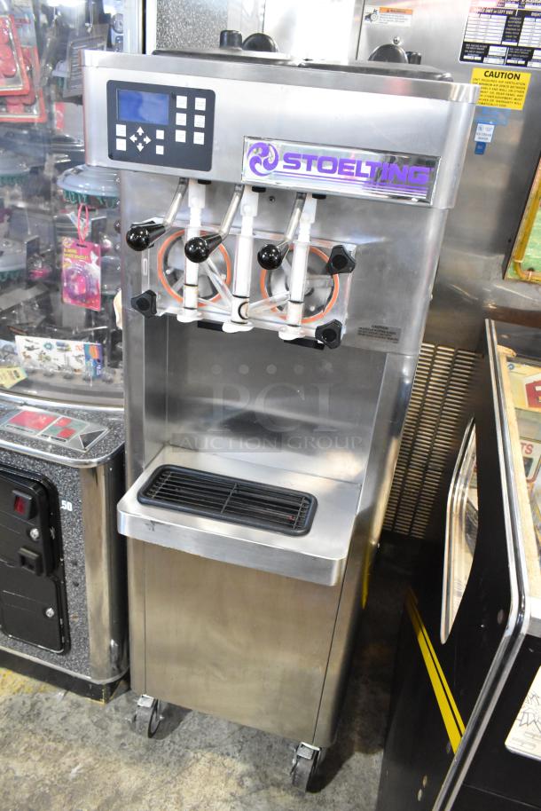 Stoelting F231-18I2YGAD1 stainless steel soft serve ice cream machine, 2 flavors plus twist, commercial casters, 208-240V.