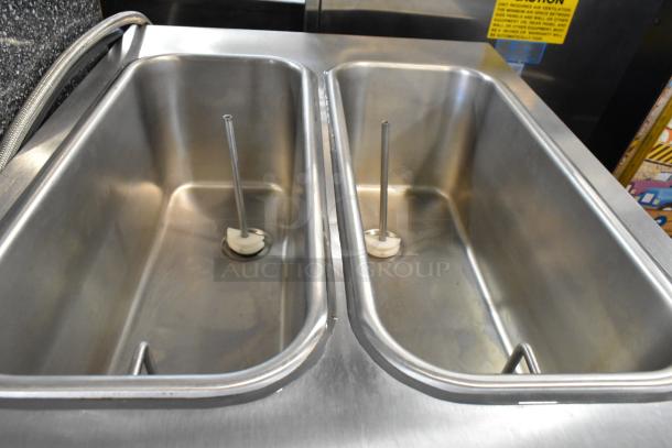 Stoelting F231-18I2YGAD1 stainless steel soft serve machine, dual flavor, twist, in excellent condition, commercial casters.