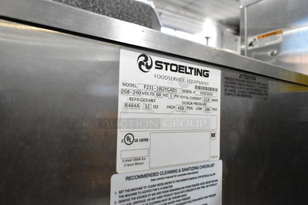 Stoelting F231-18I2YGAD1 stainless steel commercial ice cream machine label, 2-flavor twist, 208-240V, 1 phase, on casters.