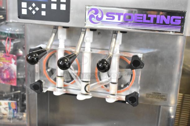 Stoelting F231-18I2YGAD1 stainless steel 2-flavor soft serve ice cream machine with twist option and digital controls.