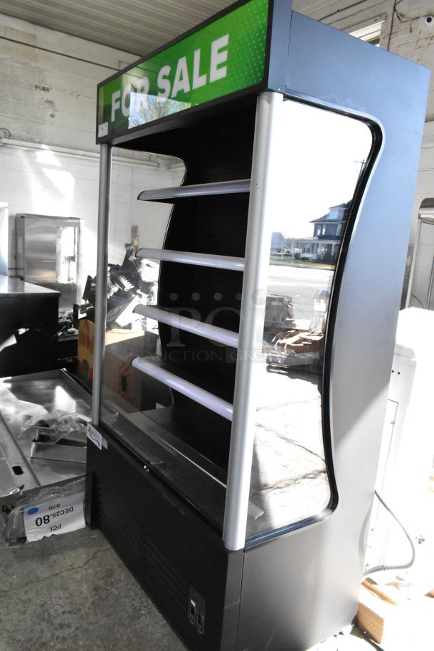 Brand new Avantco 189BVAC46HC 46" black refrigerated air curtain merchandiser, scratch and dent, on commercial casters.