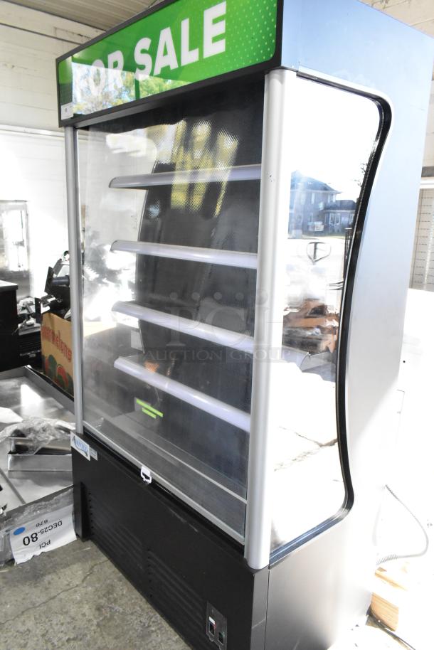 Brand new Avantco 189BVAC46HC 46" black refrigerated air curtain merchandiser, features scratch and dent condition, on commercial casters.