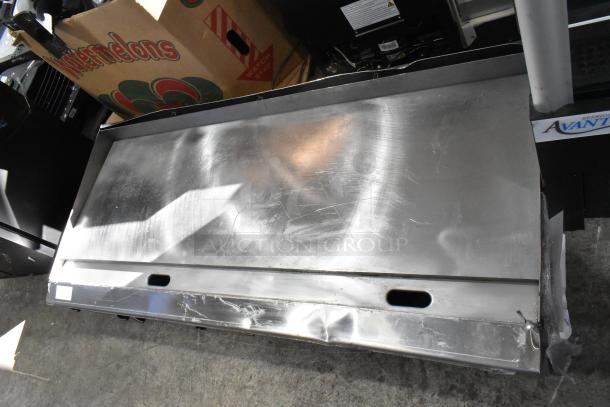 Brand new Garland 372GT72GT72N stainless steel countertop gas griddle, 168,000 BTU, with thermostatic controls, minor dents.