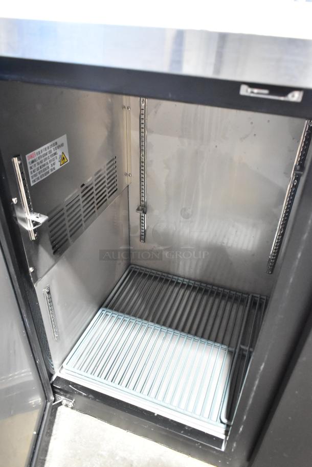 Brand new Avantco 178UBB72HC black metal back bar refrigerator, 73", LED lighting, solid door, 115V, scratch and dent.