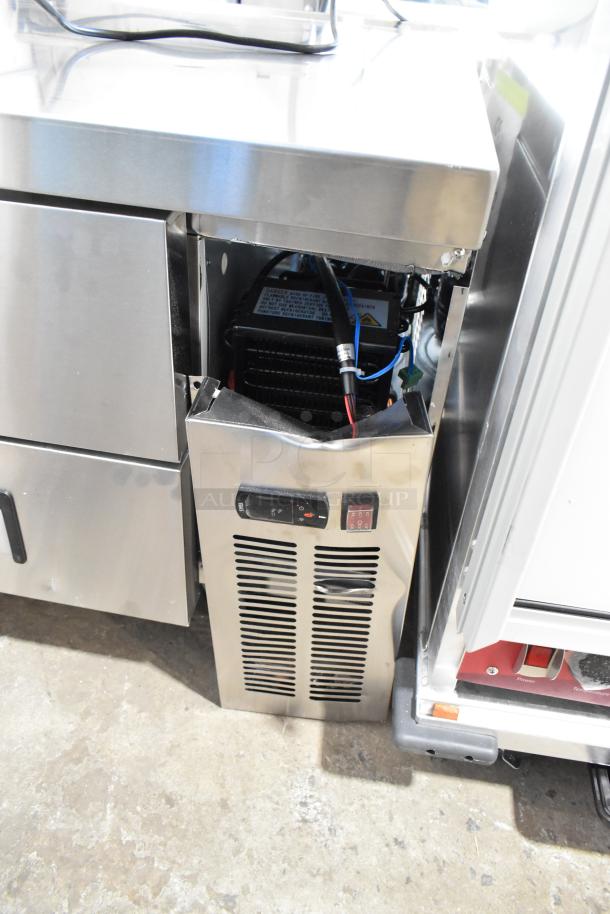 Avantco 178CBE36HC stainless steel chef base, 2 drawers, dented panel, on commercial casters, 115V, 1 phase.