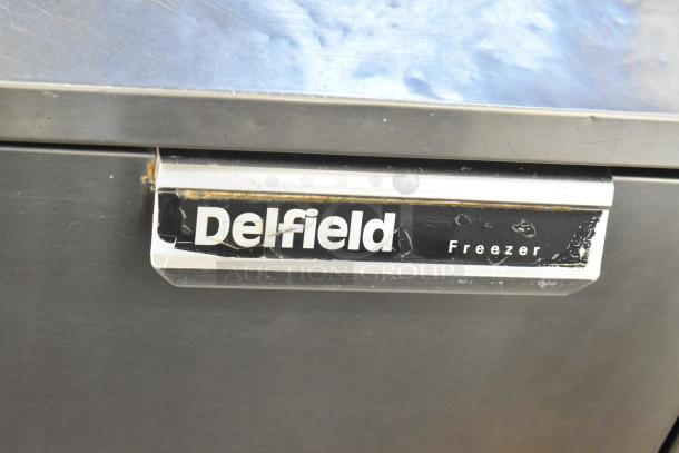 Delfield UC4148 stainless steel undercounter freezer, 2-door, on casters, 115 volts, 1 phase, minor surface wear.