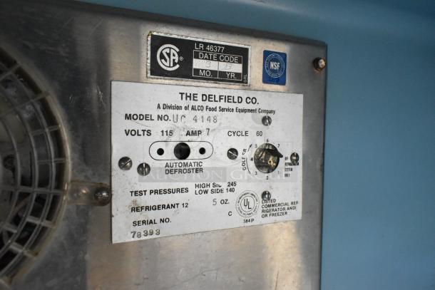 Delfield UC4148 stainless steel 2-door undercounter freezer with 115V, 1-phase power. Automatic defroster. Commercial casters.