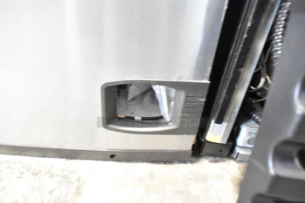 Manitowoc IY0606W-261D stainless steel commercial ice head, 208-230V, 1 Phase, showing front panel and parts inside.