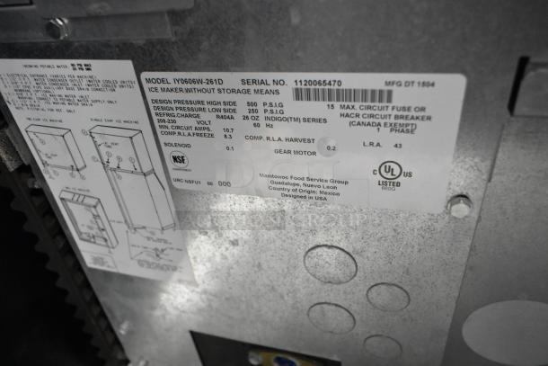 Manitowoc IY0606W-261D stainless steel commercial ice head, 208-230V, 1 Phase, detailed label with model info and specs visible.