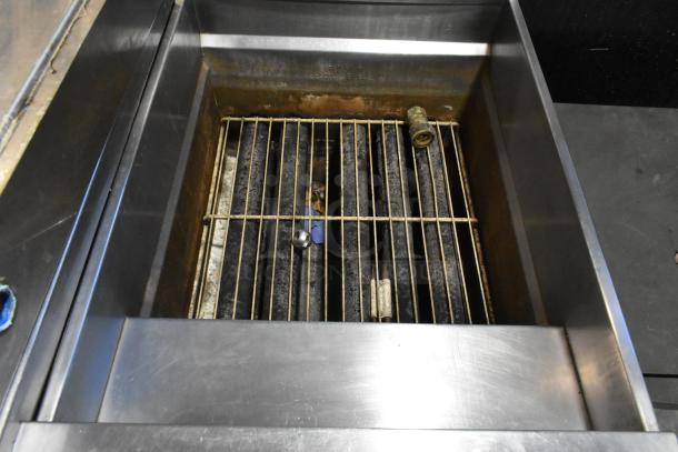 Pitco Frialator SG18 stainless steel commercial deep fat fryer, 90 lb capacity, 140,000 BTU, on casters, interior view.
