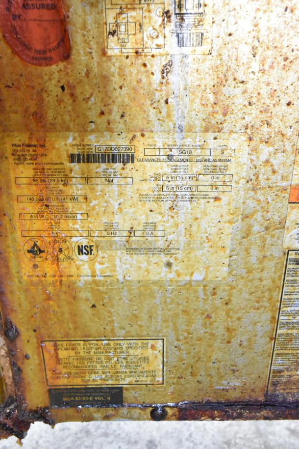 Pitco Frialator SG18 fryer label showing model, serial number, 140,000 BTU capacity, and usage instructions. Surface rust visible.