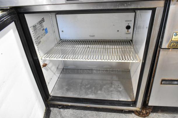 True TWT-27 undercounter cooler, stainless steel, single door, on casters, 115V, 1 phase. Interior shelf visible.