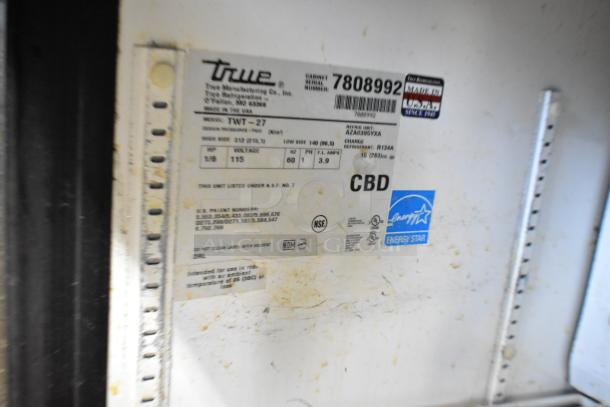True TWT-27 stainless steel undercounter cooler, single door, on casters. Model tag shows 115V, Energy Star rated.
