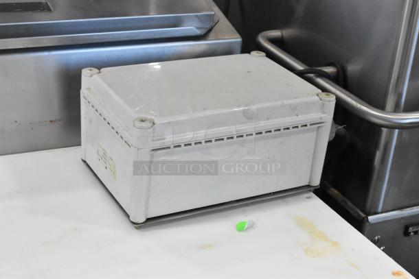 Champion stainless steel commercial corner pass through dishwasher, used, 208-240V, 1 phase, durable construction.