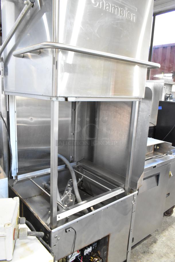 Champion stainless steel commercial corner pass-through dishwasher, featuring 208-240 volts, 1 phase. Clean condition with visible brand mark.