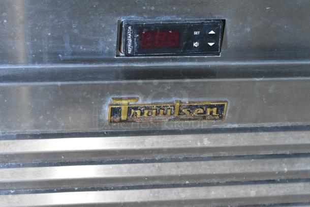 Traulsen TS066HT stainless steel commercial prep table with digital temperature display and logo, on casters. 115V, 1 Phase.