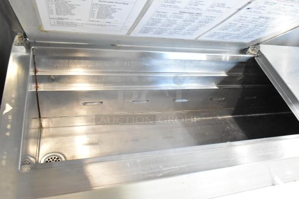 Traulsen TS066HT stainless steel commercial prep table, open view. Features include 115 volts, 1 phase, mounted on casters.