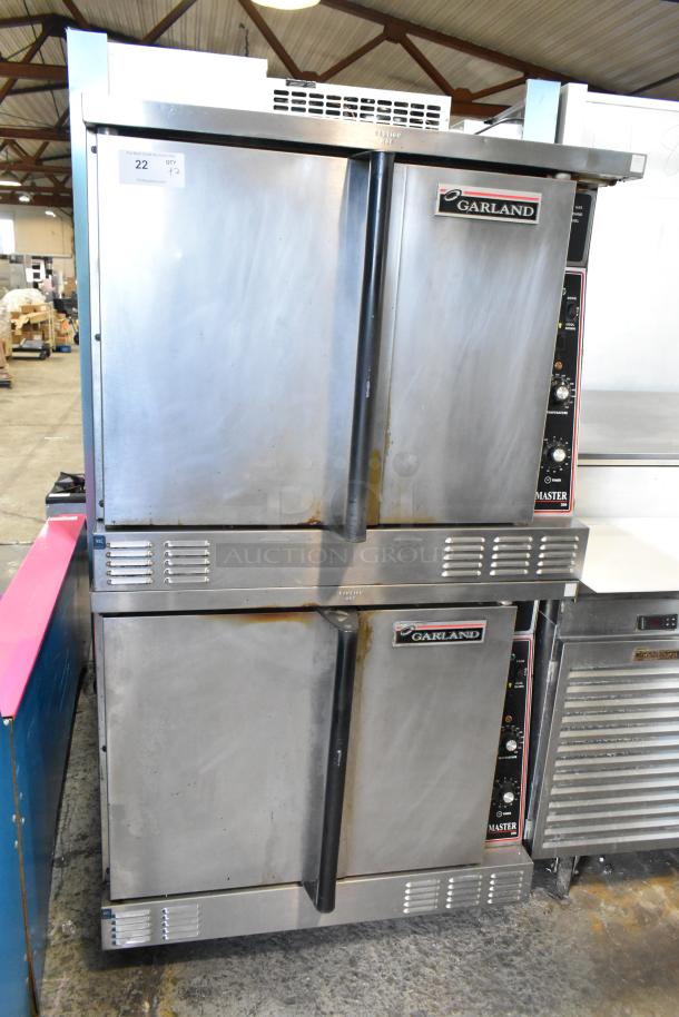 Garland Master 200 Stainless Steel Convection Ovens, double stack, solid doors, thermostatic controls, metal racks.