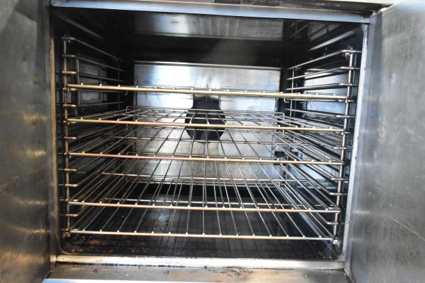 2 Garland Master 200 stainless steel commercial convection ovens with solid doors, metal racks, and thermostatic controls.