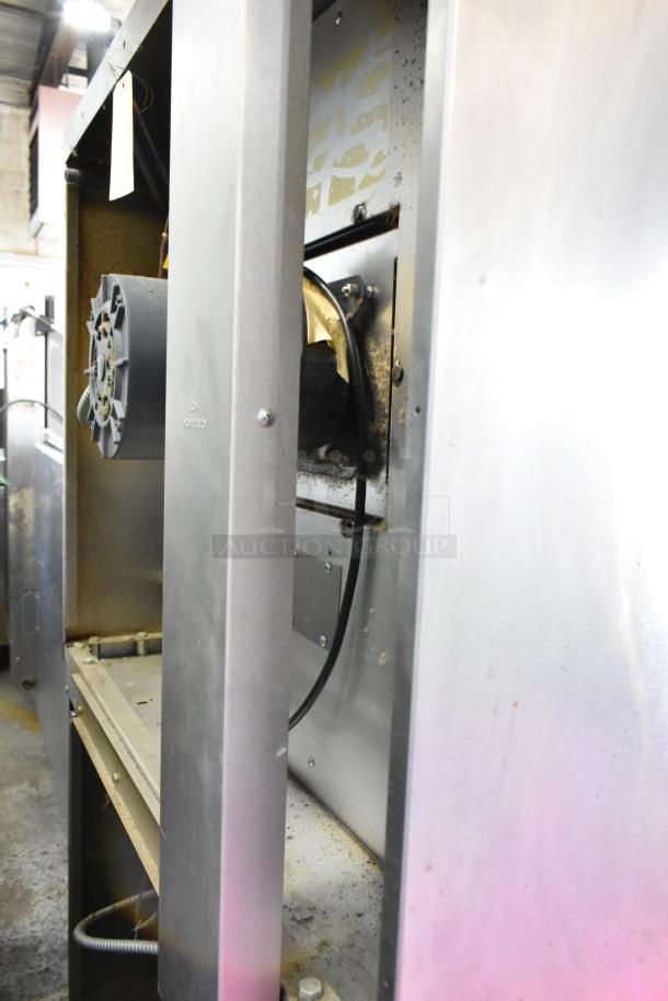 2 Garland Master 200 stainless steel commercial convection ovens with solid doors, metal racks, thermostatic controls.