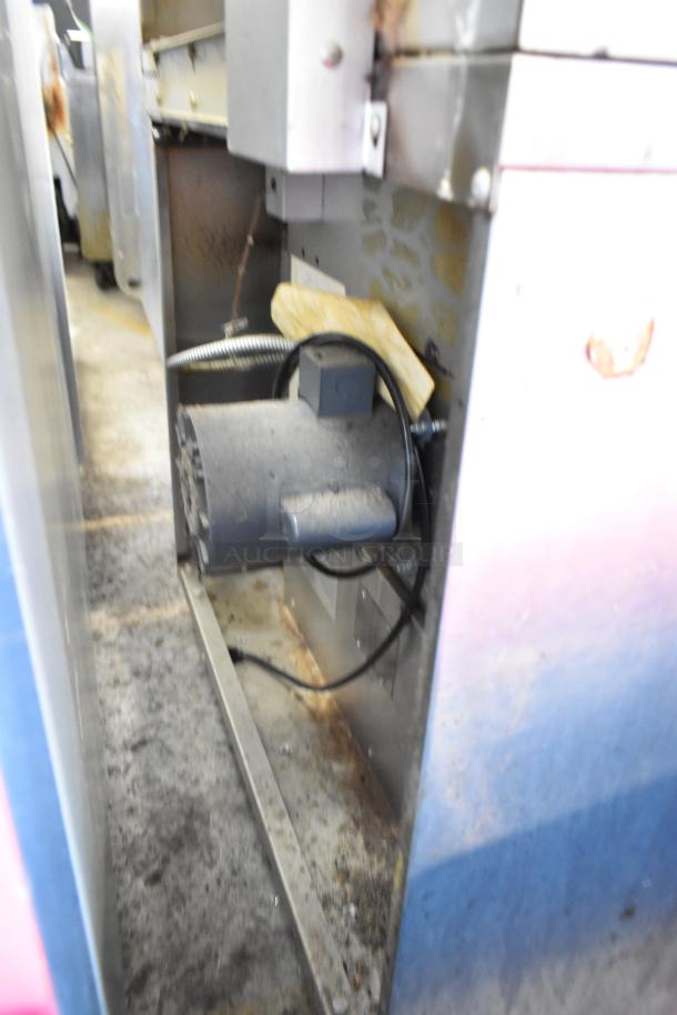 Alt text: Garland Master 200 stainless steel commercial convection oven, solid doors, metal racks, thermostatic controls.