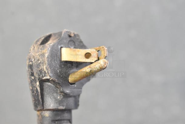 Damaged electrical plug from an Imbera G319 commercial cooler. Corroded prongs, worn housing, needs repair or replacement.