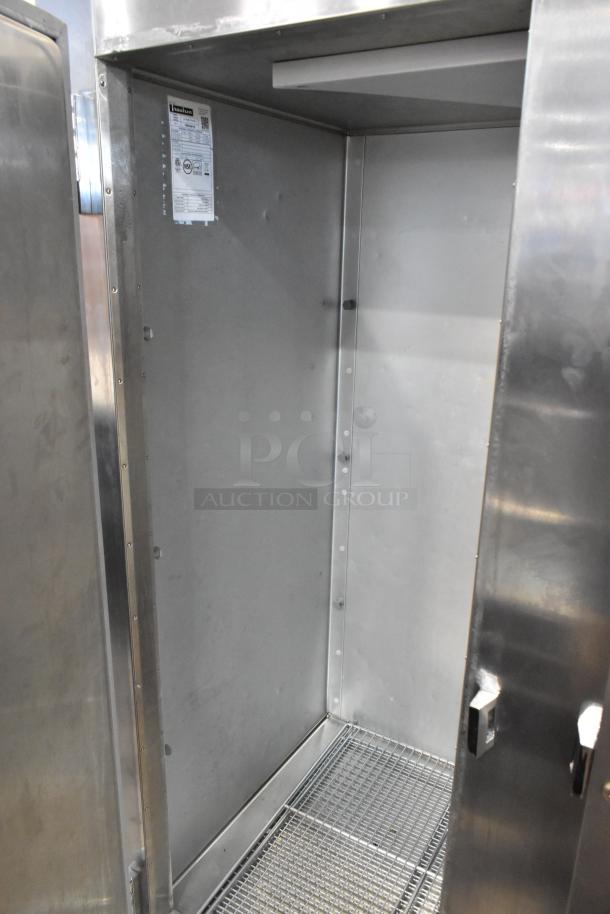 2019 Traulsen ALT232WUT-FHS-eS stainless steel commercial freezer, dual doors, poly-coated racks, 115V, excellent condition.