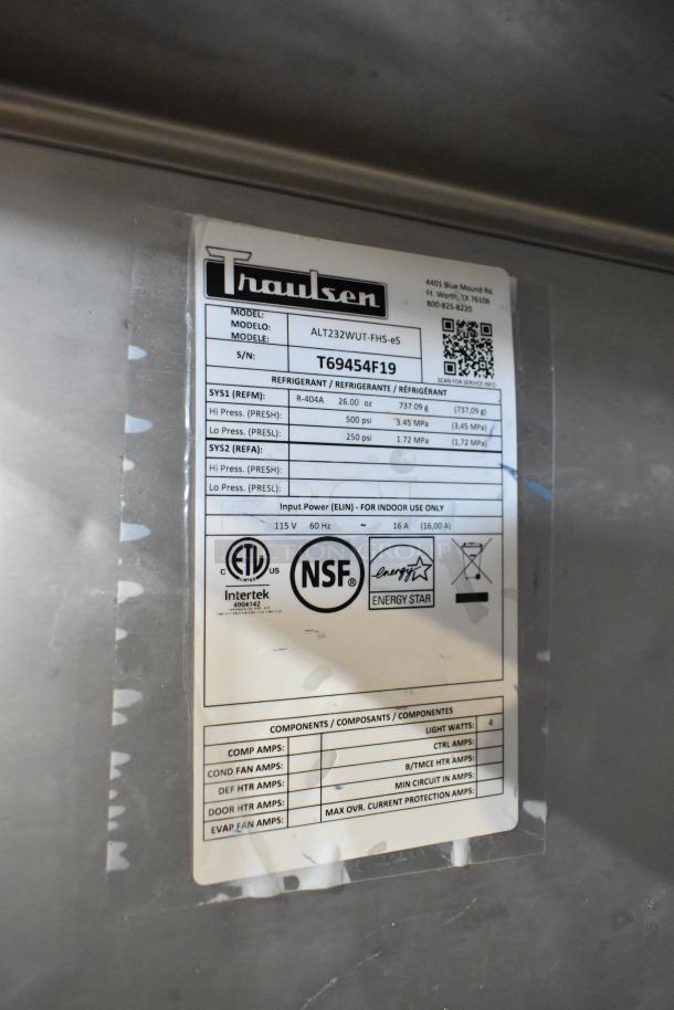 2019 Traulsen ALT232WUT-FHS-eS stainless steel commercial freezer label showing model, serial number T69454F19, and specs.