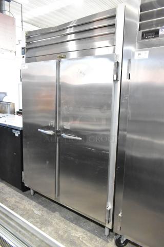 Traulsen G20010 stainless steel commercial 2-door reach-in cooler, 115V, 1 phase, with poly coated racks.