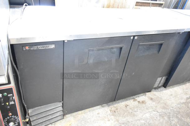 True TDD-2 metal commercial kegerator with beer tower, visible branding. 115 volts, 1 phase, good condition.
