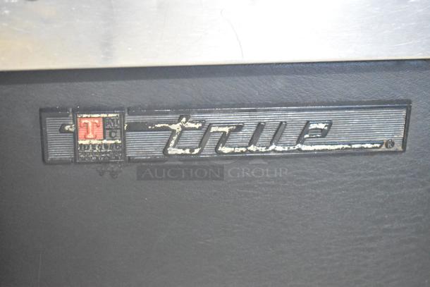True TDD-2 Metal Commercial Kegerator with beer tower, couplers, 115 volts, 1 phase. Visible True brand logo.