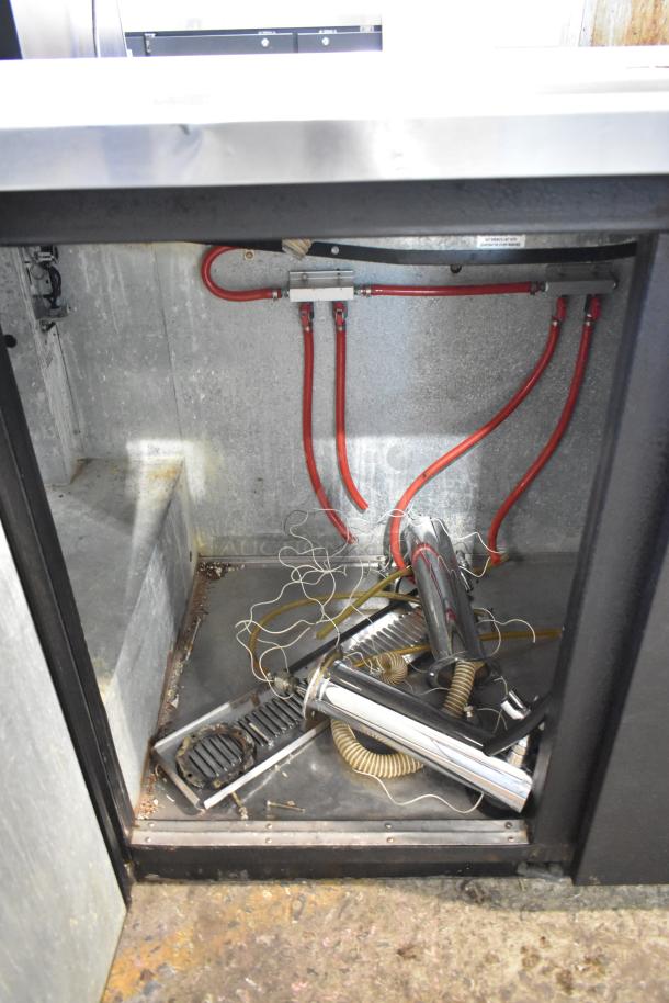 True TDD-2 metal commercial kegerator with beer tower and couplers, 115 volts, 1 phase. Visible interior hoses.