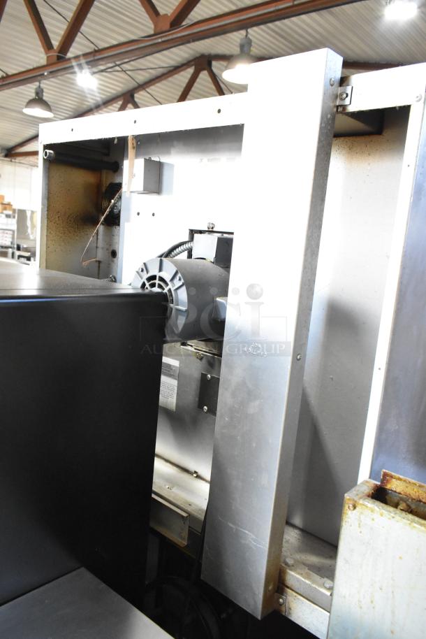 Garland Master 200 stainless steel convection ovens with solid doors, metal racks, thermostatic controls, commercial casters.