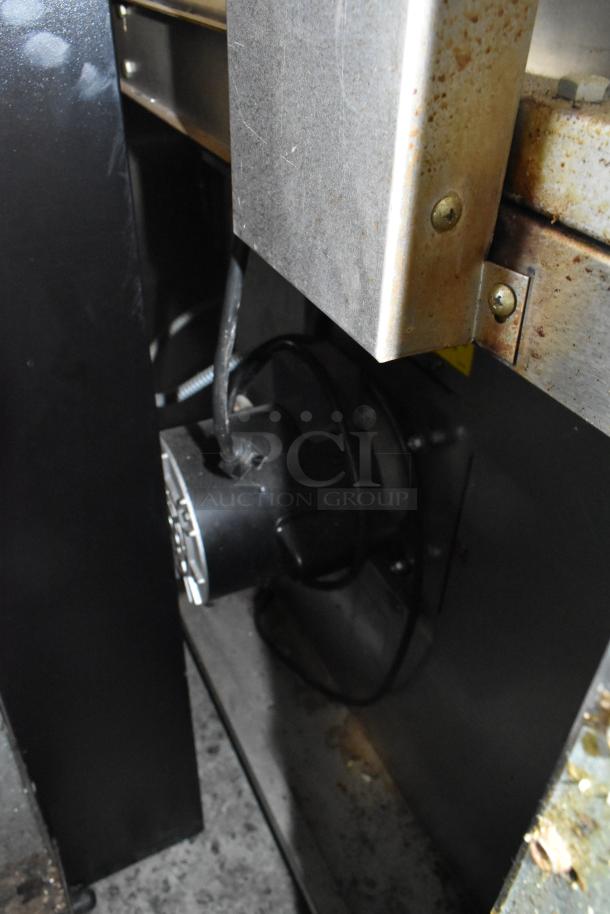 Garland Master 200 convection ovens, stainless steel, solid doors, metal racks, thermostatic controls, commercial casters.