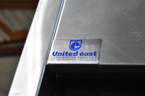 Delfield stainless steel 2-door reach-in cooler; left door locked. Features United East label. 115V, 1 phase.