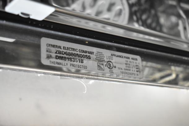 General Electric GE ZBD6880N00SS Monogram Stainless Steel Undercounter Dishwasher. Label shows model and serial number details.