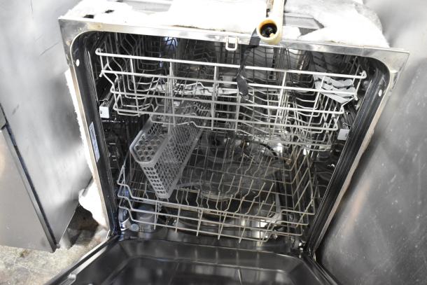 General Electric GE ZBD6880N00SS Monogram stainless steel undercounter dishwasher, open view, racks visible, used condition.