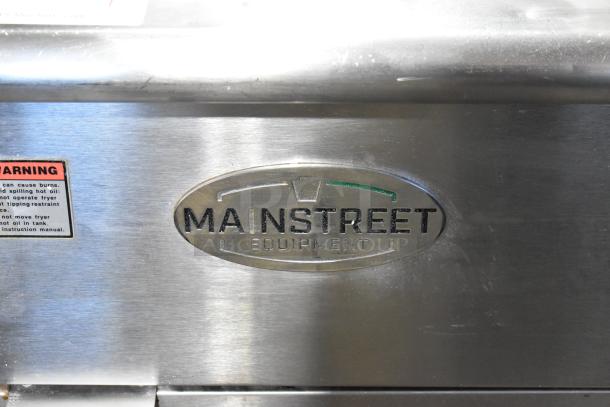 Mainstreet Stainless Steel Commercial Floor Style Deep Fat Fryer with logo and safety warning label visible.