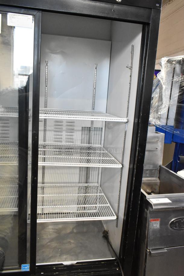 Habco ESM42 metal commercial 2-door reach-in cooler with poly-coated racks, 115 volts, 1 phase, in used condition.