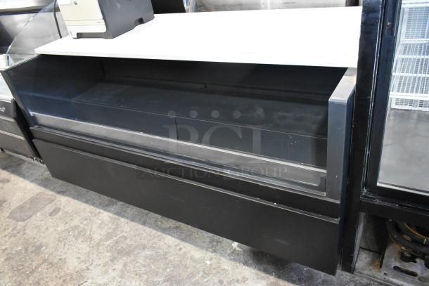 Metal commercial floor-style horizontal Grab N Go merchandiser, black finish, open shelving, good condition.