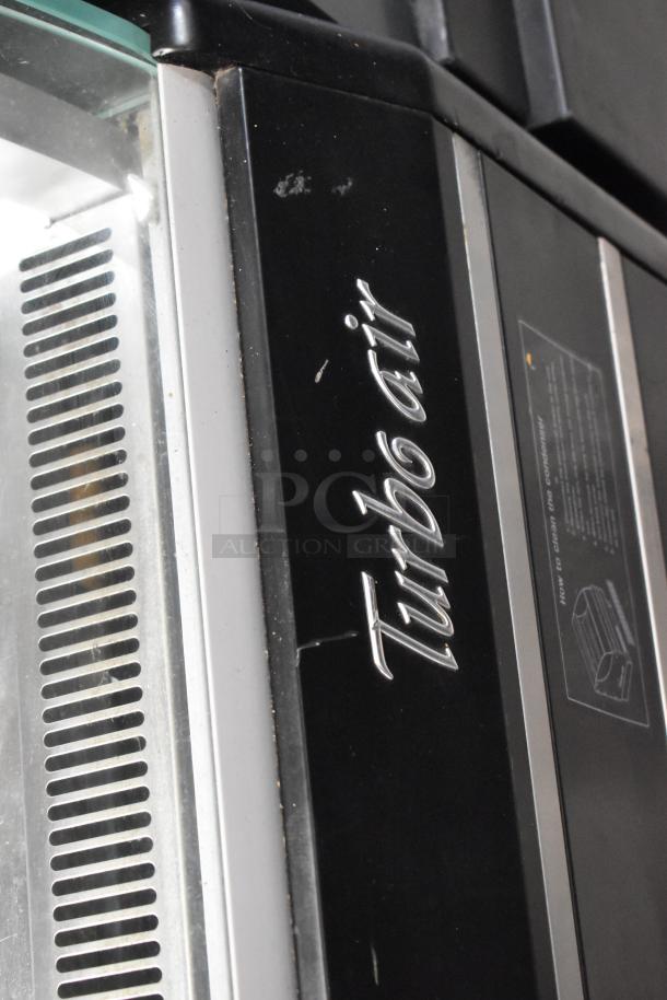 Turbo Air TOM-60SB commercial horizontal open air merchandiser in black, metal casing, visible logo, 115 volts, 1 phase.
